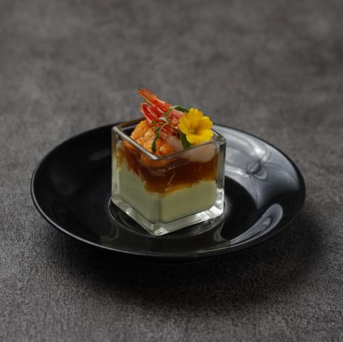 Seasonal vegetable mousse topped with sea urchin and sweet shrimp and lobster consommé jelly (1 serving)