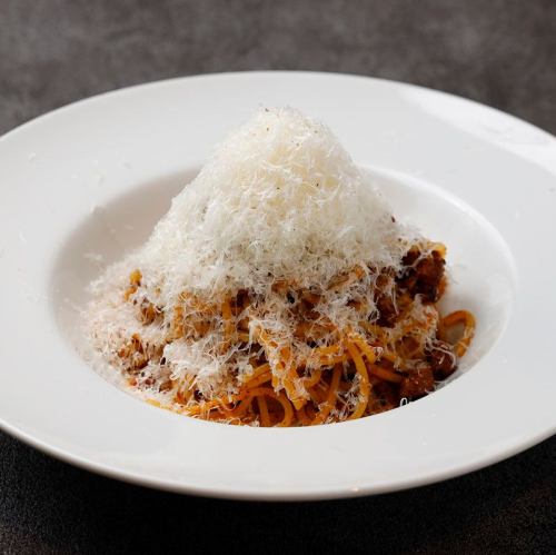 Bolognese pasta with a mountain of cheese