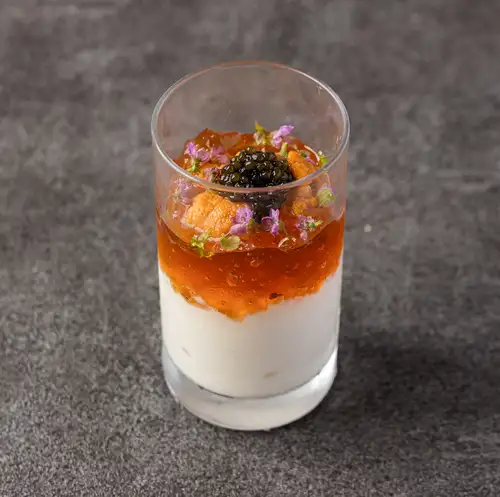 Rice bavarois with sea urchin and caviar, served with consommé jelly.