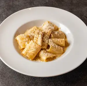 Rich cheese carbonara with paccheri pasta