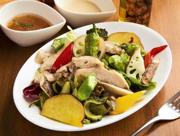 Salad with homemade herb chicken and colorful vegetables