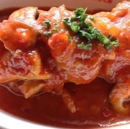 Chicken leg stewed in tomato sauce