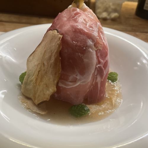La France pear stuffed with stracciatella, French prosciutto, cinnamon and clove pear puree