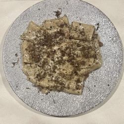 Guanciale and mushroom paste carbonara with Italian truffles and paccheri