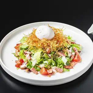 Poached egg Caesar salad with crispy topping