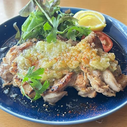 Hearty grilled chicken thighs with aromatic vegetables, diavolo style