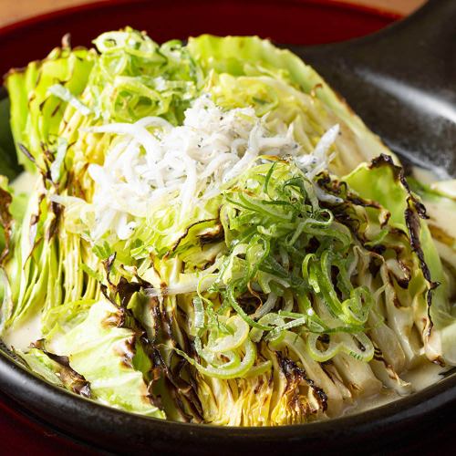 Grilled cabbage with charred green onion sauce