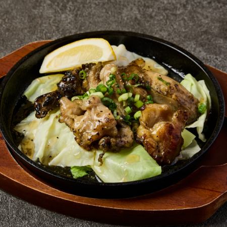 Unlimited chicken belly charcoal grilled on a hot plate