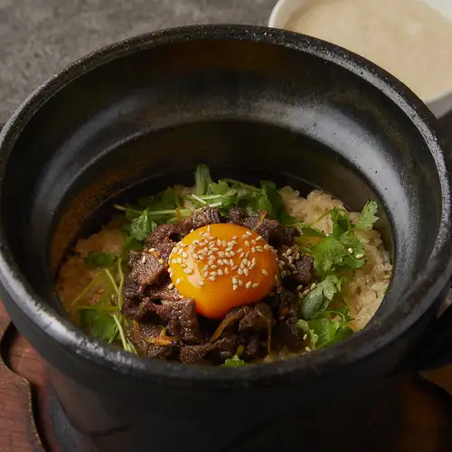 Beef tongue and delicious, tender rice cooked in an earthenware pot.