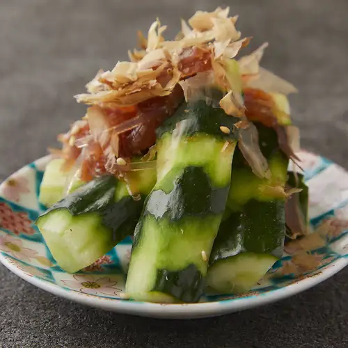 Roughly chopped cucumber with plum jelly dressing