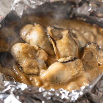 Grilled oysters on a foil