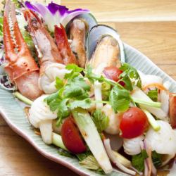 Seafood spicy herb salad "Yam Luam Mi Talay"