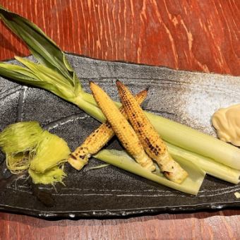 Grilled baby corn over charcoal