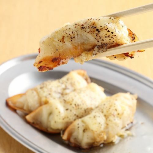 Dumplings drowning in butter and cheese