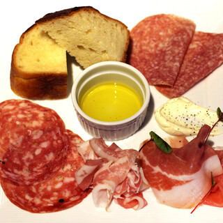 Assortment of 3 types of raw ham and salami