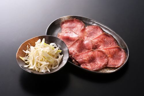 Hand-cut raw beef tongue with green onion and salt