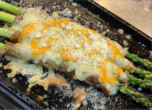 Asparagus wrapped in pork and cheese
