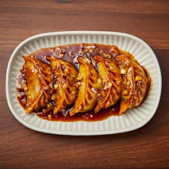 Deep-fried dumplings with black vinegar sauce