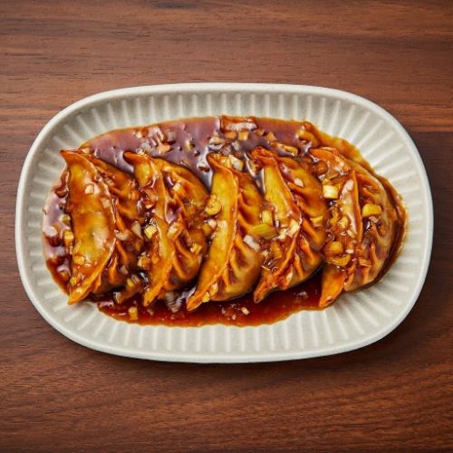 Deep-fried dumplings with black vinegar sauce