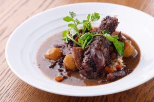 Chicken thighs on the bone, aromatic vegetables, chestnuts and mushrooms stewed in red wine - Coq au Vin