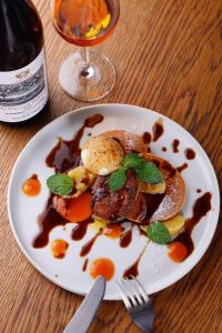 Sautéed foie gras with Madeira sauce, persimmon puree and glace pancakes