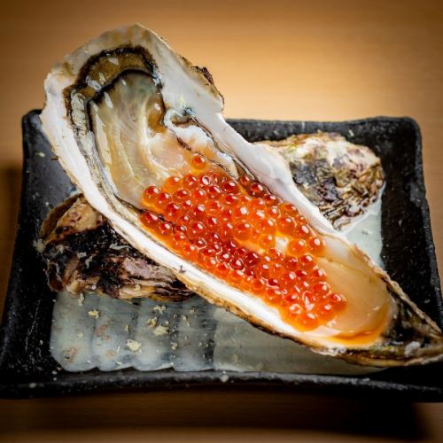 Raw oysters with salmon roe