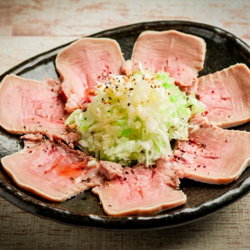 Tongue sashimi covered in green onions