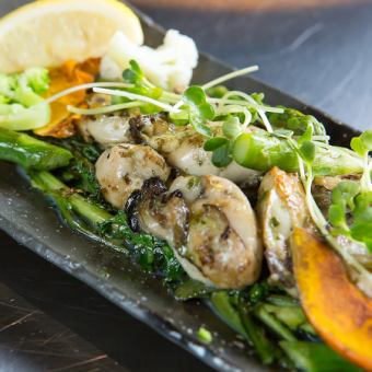 Grilled seasonal vegetables and oysters with herb butter