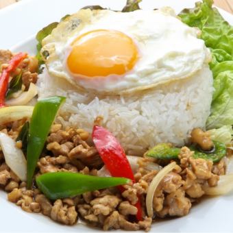 Basil fried chicken rice topped with a fried egg (Gapao Gailat Khao)