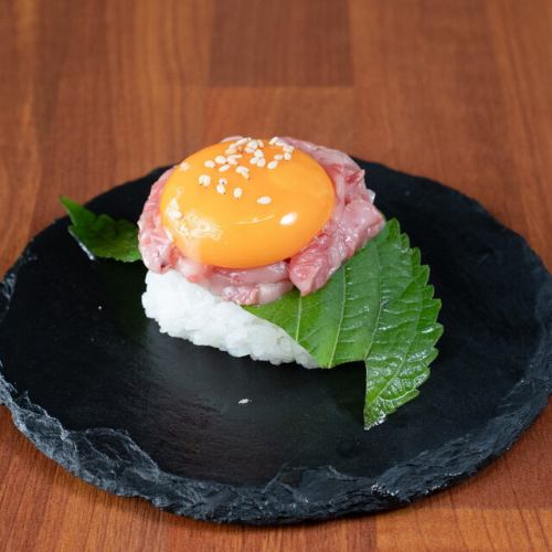 Grilled beef yukhoe sushi topped with egg yolk