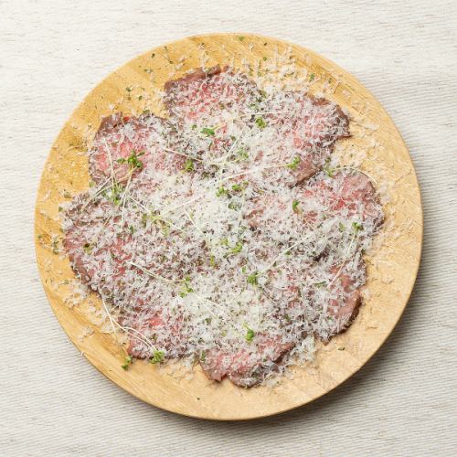 Roasted beef carpaccio with lots of parmigiano cheese