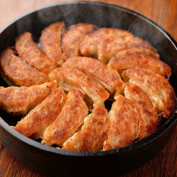 Hakata Tetsunabe Gyoza is served to our customers in a hot iron pot.Very juicy inside.