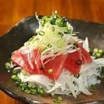 Bluefin tuna covered with green onions