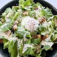 Hot ball Caesar salad with prosciutto