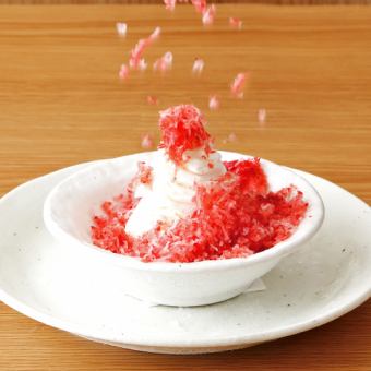 Freshly shaved strawberries and vanilla ice cream