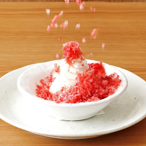 Freshly shaved strawberries and vanilla ice cream