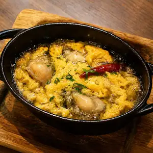 Oyster and egg ajillo