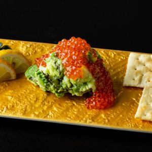 Avocado potato salad topped with salmon roe