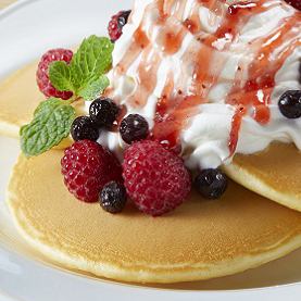 Pancakes made with frozen raspberries and chocolate sauce
