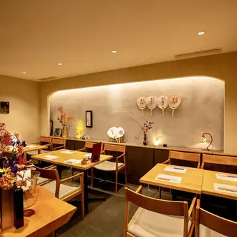 Three tables seating four people each.Enjoy a sophisticated adult gathering in our spacious and comfortable seating area, perfect for entertaining clients or after-work drinks.