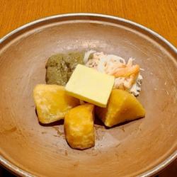 カニ身とカニ味噌バターの陶板焼き