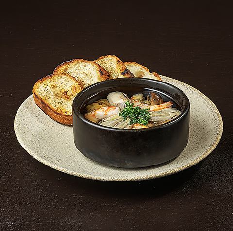 Oyster and shrimp ajillo with garlic butter baguette