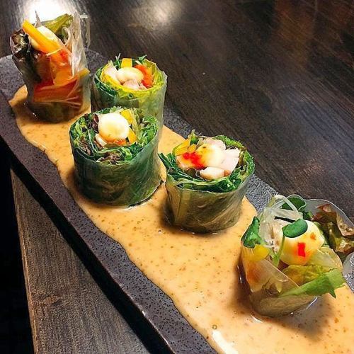 Fresh spring rolls with colorful vegetables and chicken
