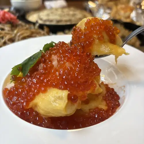 Fluffy eggs with overflowing salmon roe
