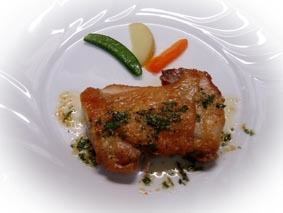 Domestic chicken thigh steak grilled with herb oil