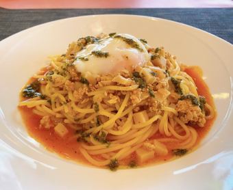 Bamboo shoot and chicken ragout pasta with basil sauce and soft-boiled egg