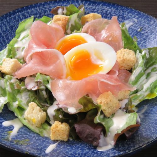 Poached egg on Caesar salad