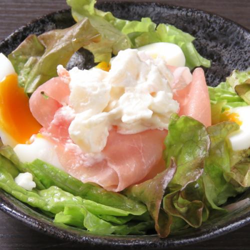 Potato salad of raw ham and soft-boiled egg
