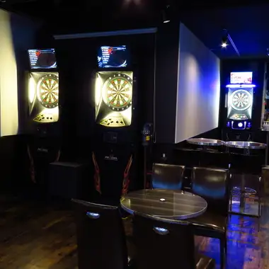 Having a drink while watching darts...