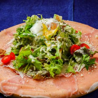 Caesar salad with dry-cured ham and boiled egg